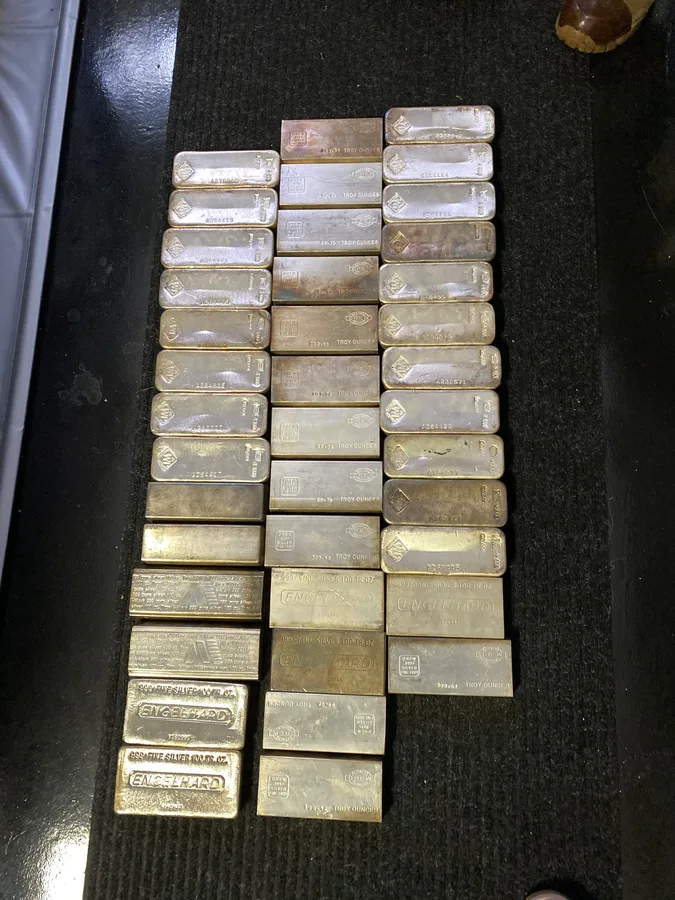 Rows of 100 troy ounce .999 fine silver bars, Engelhard and Drew, from a Miller Estate Solutions liquidation